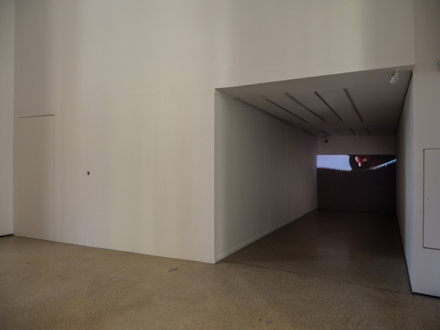Rosa Moreno, <i>Sans titre</i>, 2026 Dimensions variables, trou. Courtesy de l’artiste. © ADAGP, Paris, 2026. Jonathan Martin, In my bag (Neurotic Runaway), 2026 3’ 37’’, vidéo HD, mono.  Courtesy de l’artiste. © ADAGP, Paris, 2026. Vue de l’exposition « over the top, undercover » à la Fondation Pernod Ricard, Paris, 2026. © Photo : Raphaël Massart Courtesy de la Fondation Pernod Ricard.