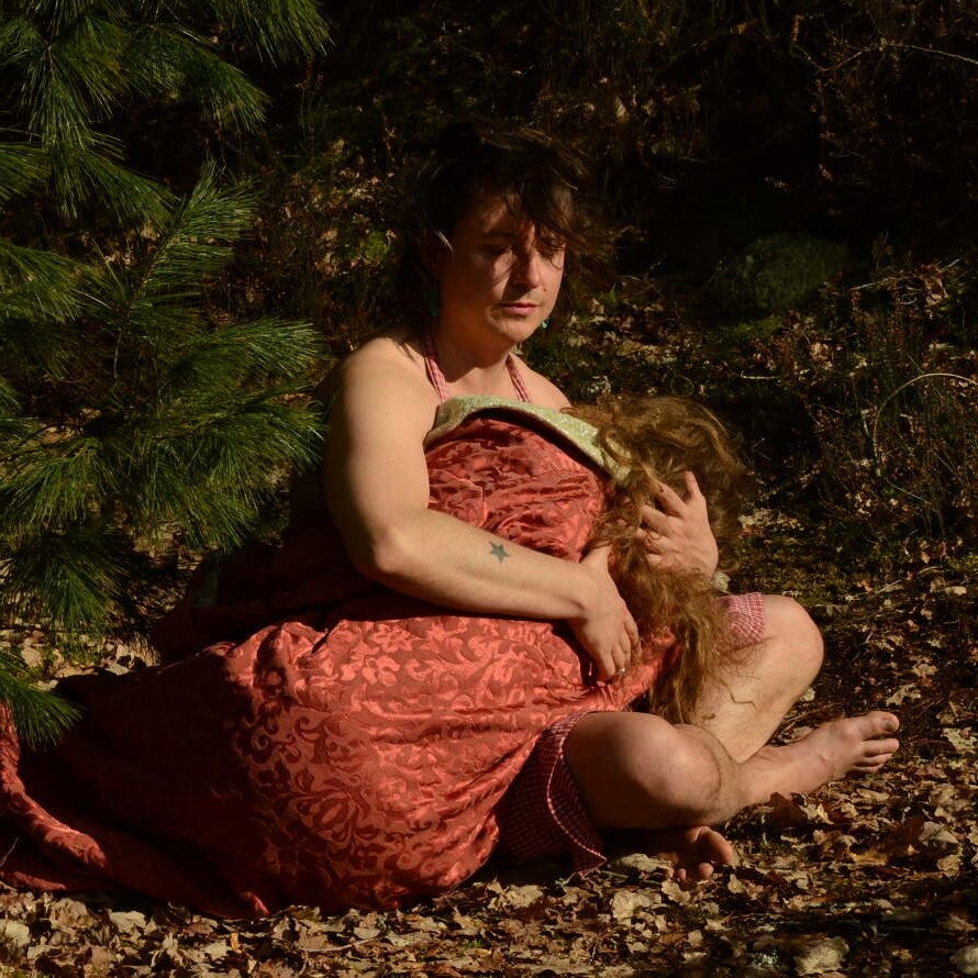 Emma Bigé et Filippo Pasquali dans a pine cone covered in dog drool hanging in a golden jockstrap (2023), courtesy A. Livingstone et Léo love Gentil.