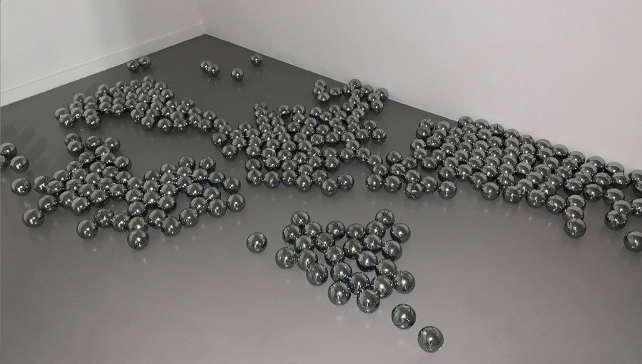Marie Angeletti, Polished balls, 2023, polished pétanque balls, dimensions variable. Courtesy of the artst and Edouard Montassut, Paris.